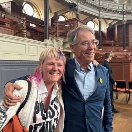 Clare Farrell being hugged by author Kim Stanley Robinson at the launch of Oxford’s Ministry For the Future